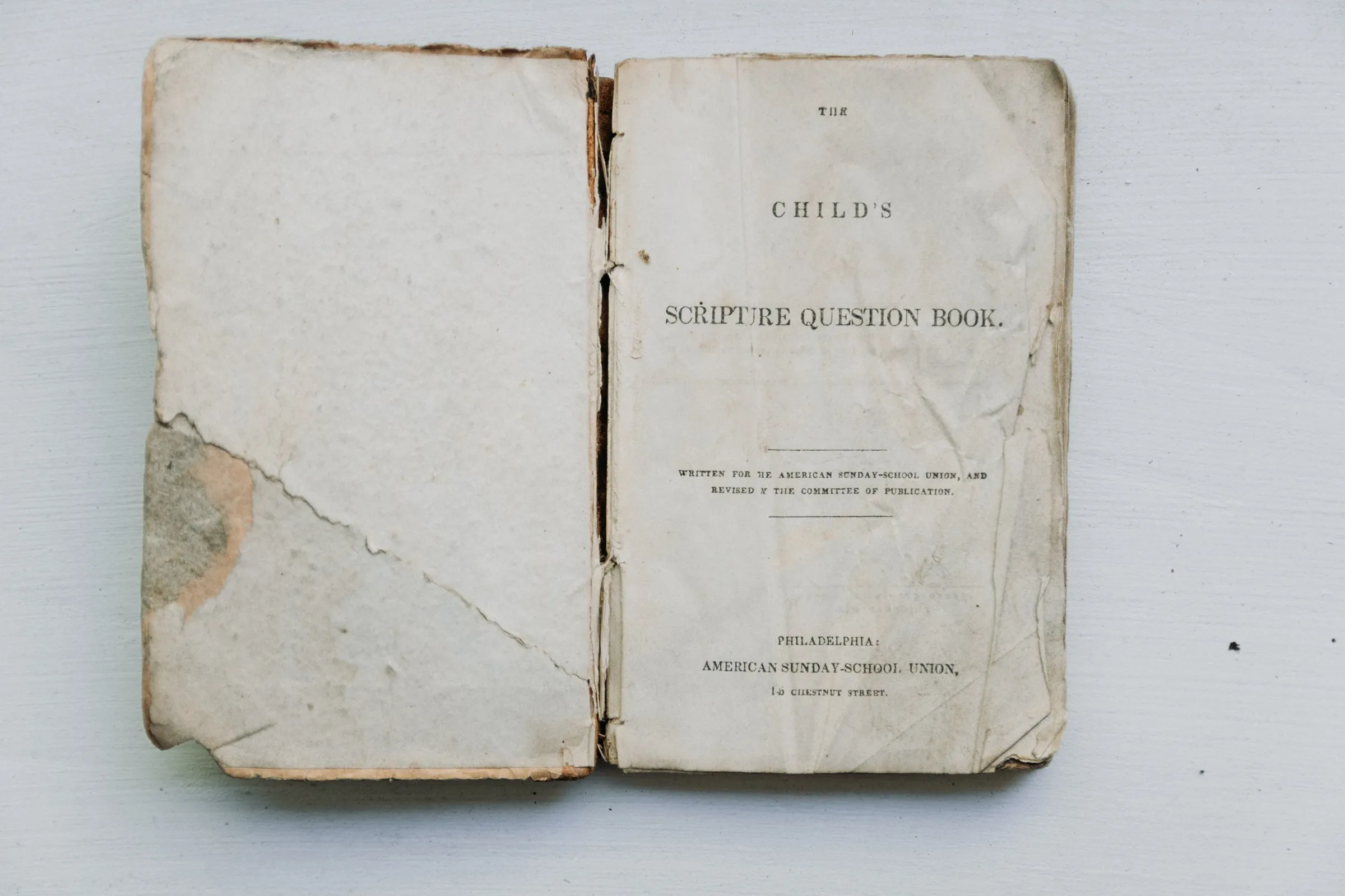 An antique open book with worn pages