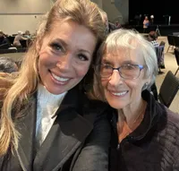 Janine Davis smiling beside Michelle